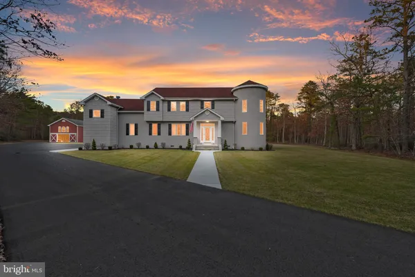 a view of a big house with a big yard
