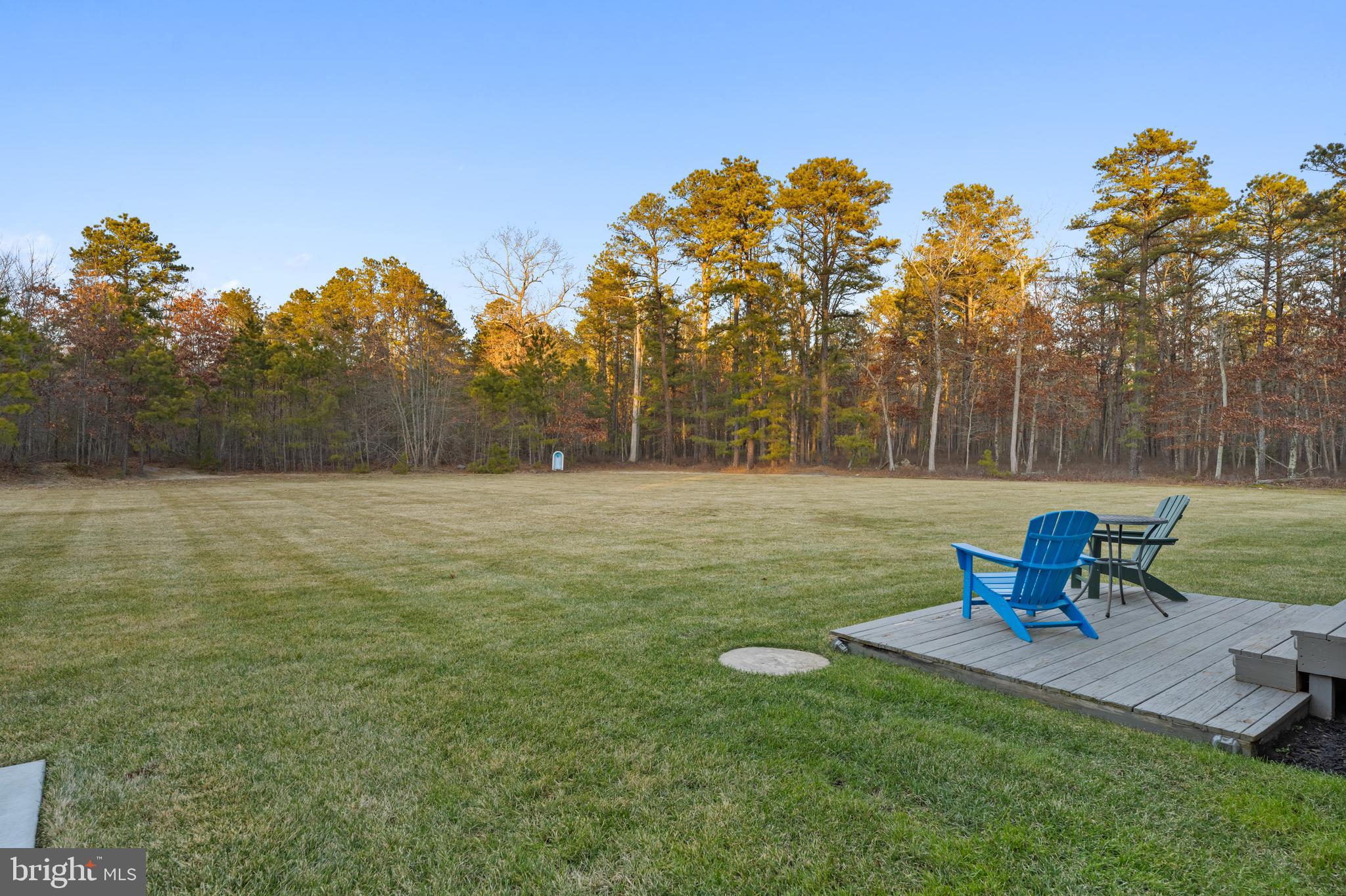 83 Maple Avenue Mays Landing, NJ 08330 - Photo 19 of 46 a view of a bench in the garden near a lake
