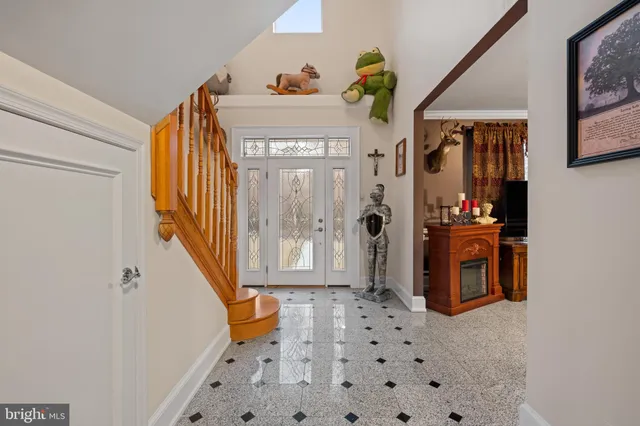 a kitchen with stainless steel appliances granite countertop wooden floor window and refrigerator