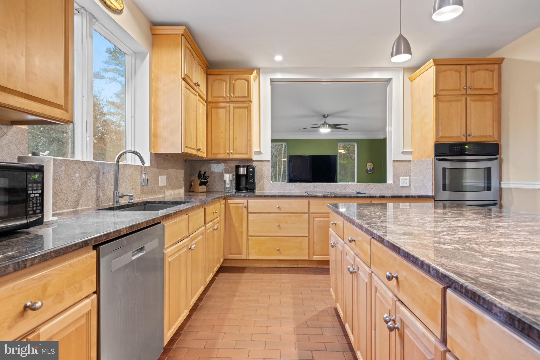 83 Maple Avenue Mays Landing, NJ 08330 - Photo 24 of 46 a large kitchen with stainless steel appliances granite countertop a stove a sink and a microwave