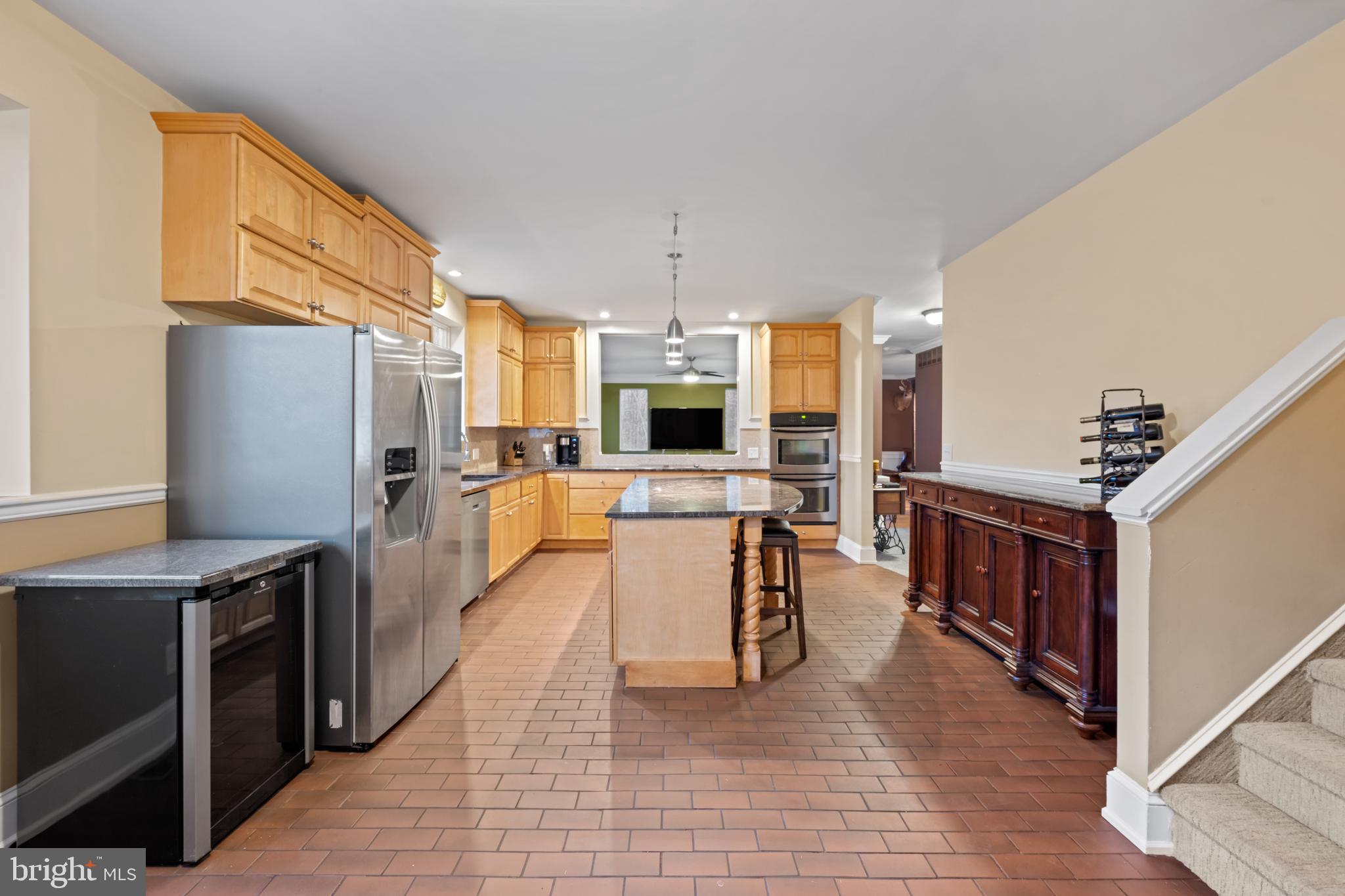 83 Maple Avenue Mays Landing, NJ 08330 - Photo 25 of 46 a view of a kitchen with kitchen island a counter top space a sink stainless steel appliances and cabinets