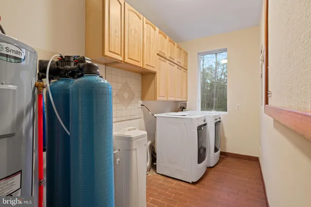 a bedroom with a bed and glass window