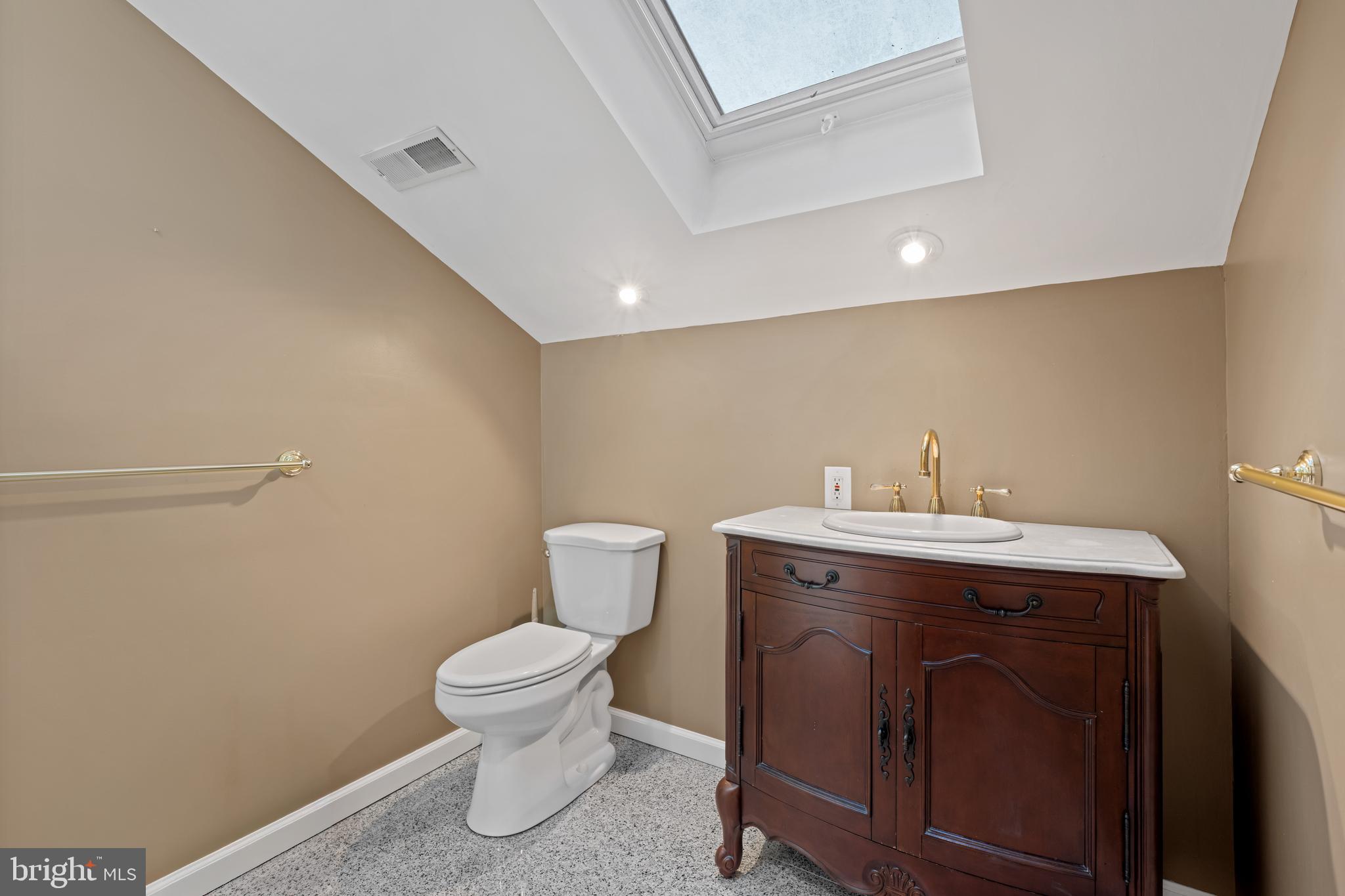 83 Maple Avenue Mays Landing, NJ 08330 - Photo 45 of 46 a bathroom with a toilet a sink and mirror