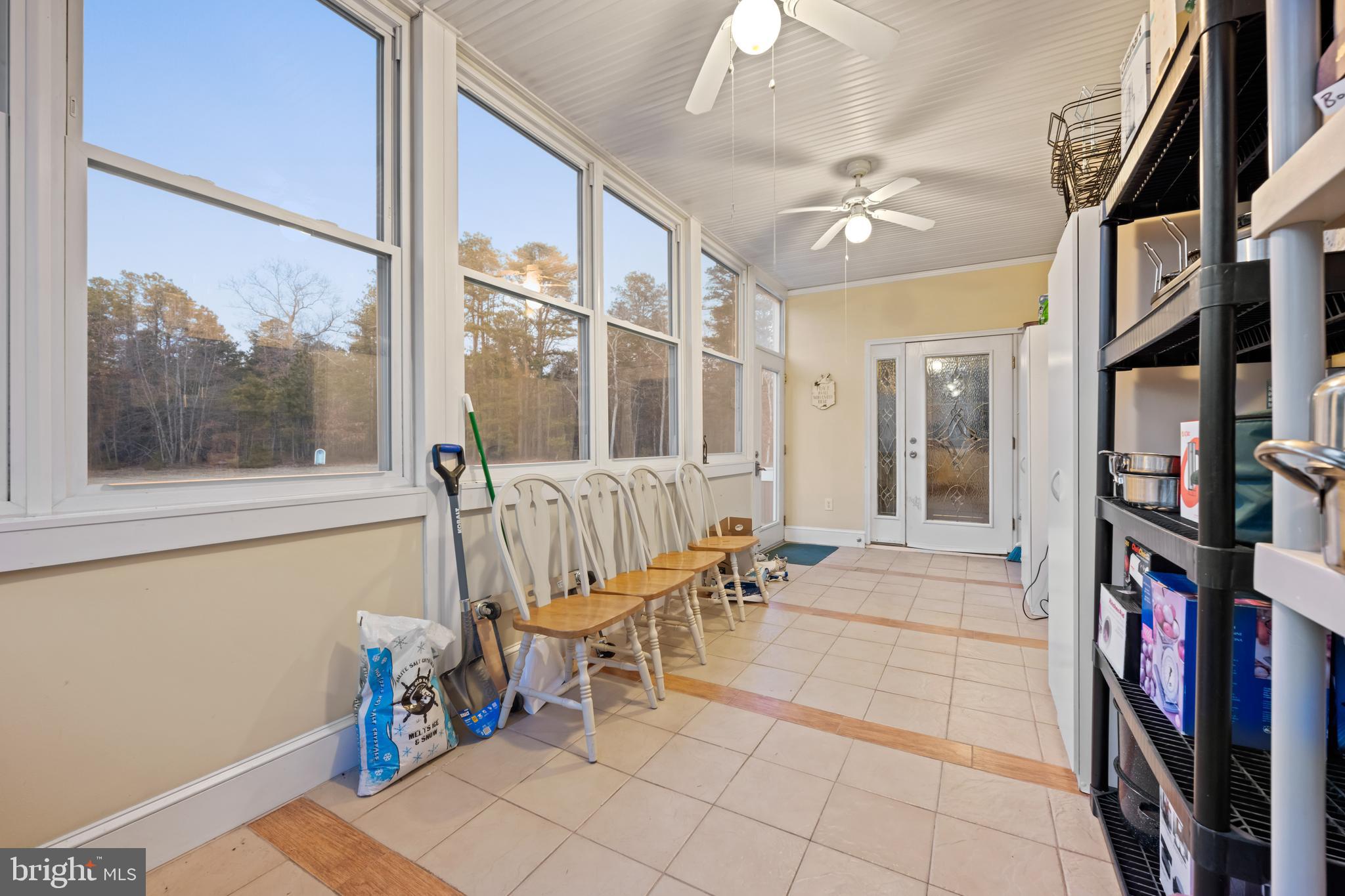 83 Maple Avenue Mays Landing, NJ 08330 - Photo 46 of 46 a living room with furniture a bookshelf and a large window