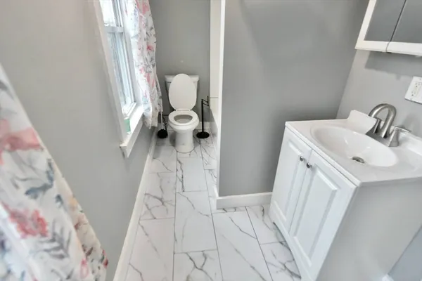 a bathroom with a sink and toilet