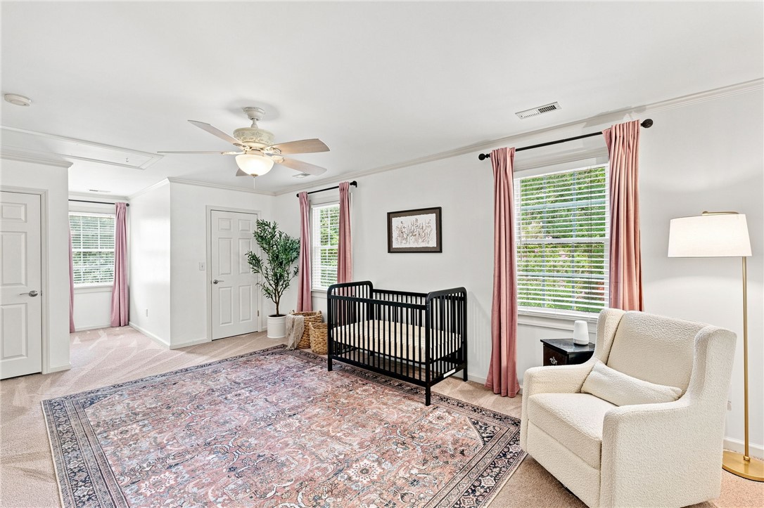 320 Watson Road Easley, SC 29642 - Photo 27 of 50 Generous windows fill this airy bedroom with natural light highlighting the classic crown molding.