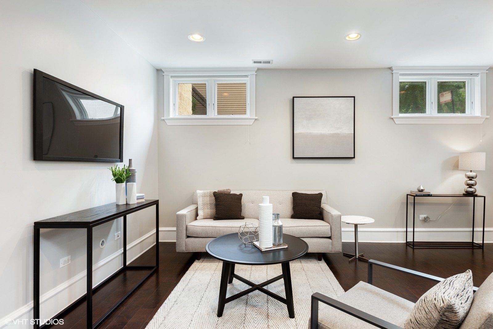 1503 North Mohawk Street, Unit 1E Chicago, IL 60610 - Photo 12 of 25 a living room with furniture a flat screen tv and a window