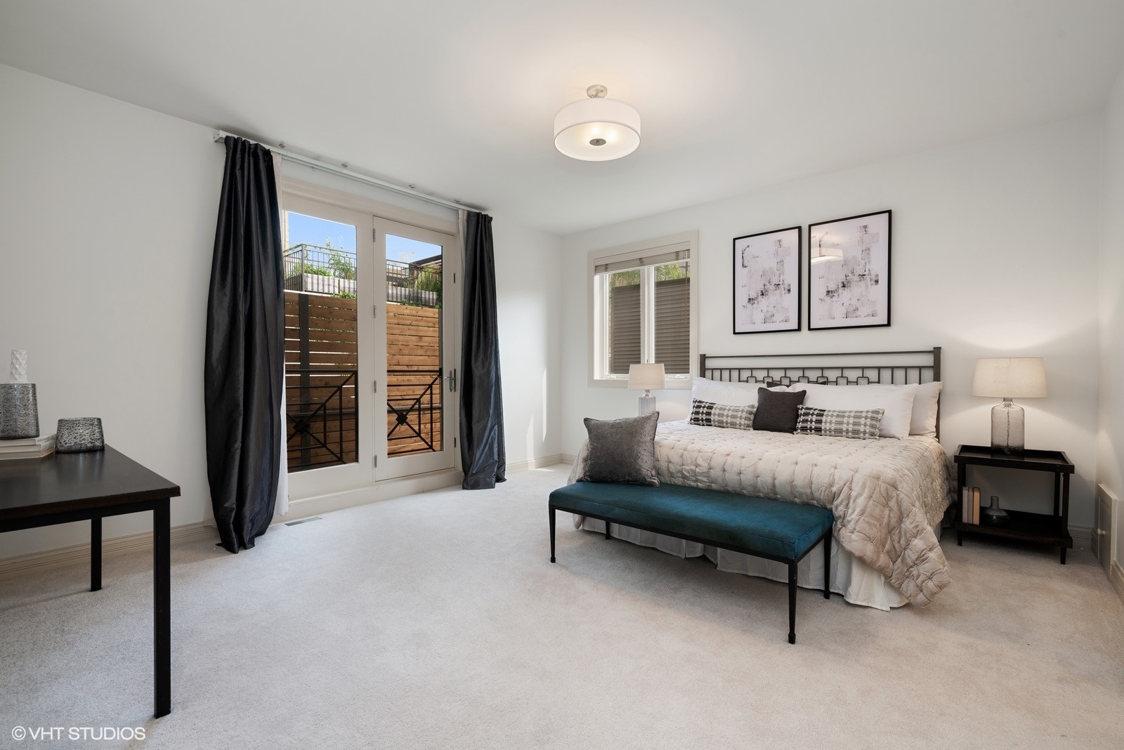 1503 North Mohawk Street, Unit 1E Chicago, IL 60610 - Photo 13 of 25 a spacious bedroom with a bed and a chandelier