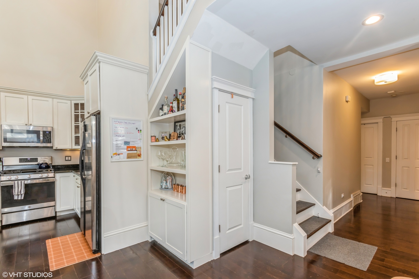 1503 North Mohawk Street, Unit 1E Chicago, IL 60610 - Photo 8 of 25 a view of a kitchen with white cabinets and stainless steel appliances