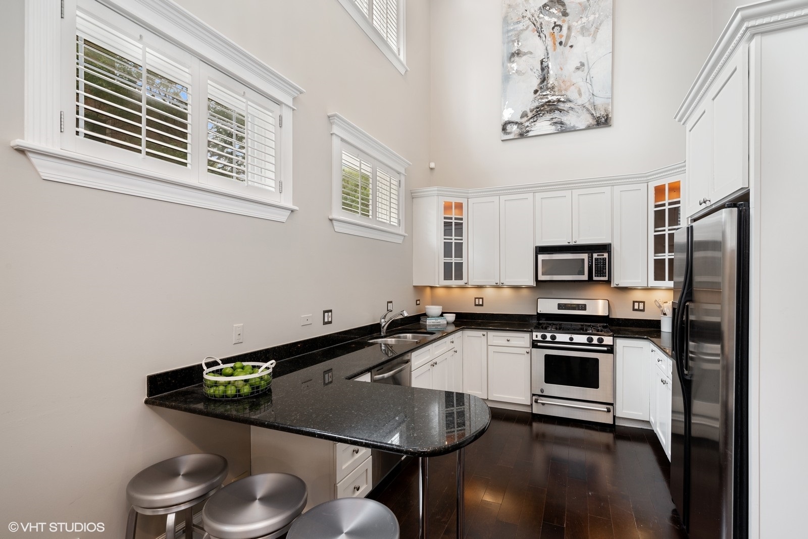 1503 North Mohawk Street, Unit 1E Chicago, IL 60610 - Photo 9 of 25 a kitchen with stainless steel appliances a stove a sink and a microwave