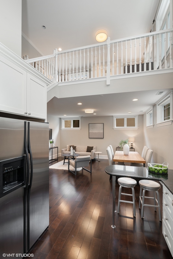 1503 North Mohawk Street, Unit 1E Chicago, IL 60610 - Photo 10 of 25 a living room with furniture and a table