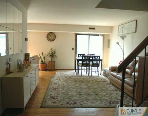 5901 Hana Road Edison, NJ 08817 - Photo 3 of 8 a living room with chairs and a table