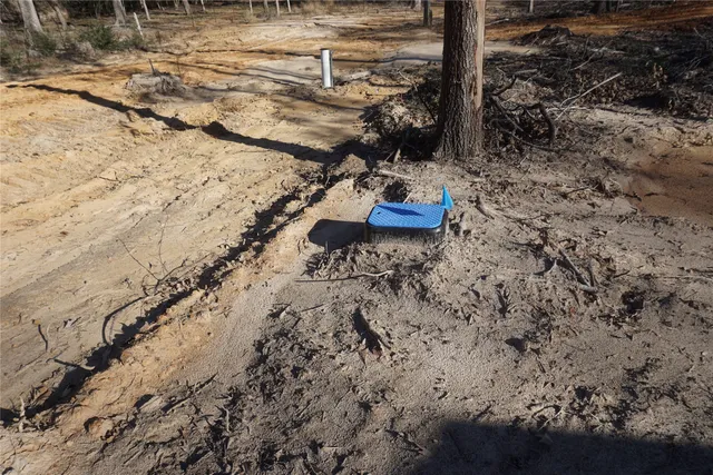 a view of a backyard with water fountain