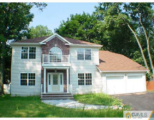 84 Harding Avenue Edison, NJ 08820 - Photo 1 of 8 front view of a house with a yard