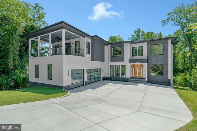 a dining room with furniture and a large window