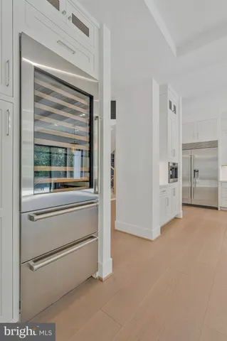 a bathroom with a toilet and a window