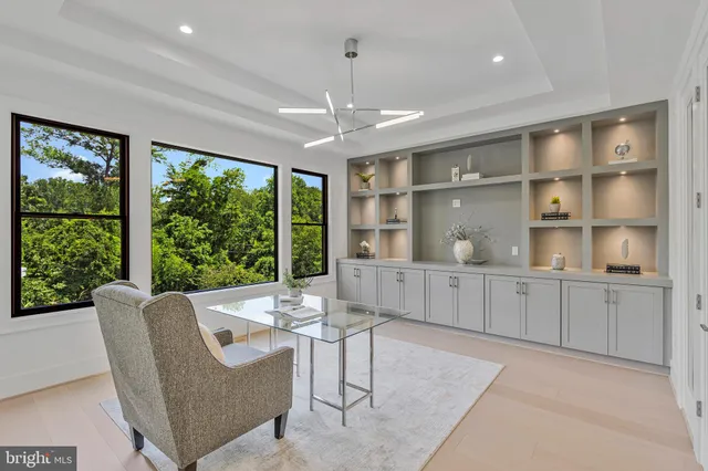 a large kitchen with stainless steel appliances granite countertop a large counter top a sink and a stove