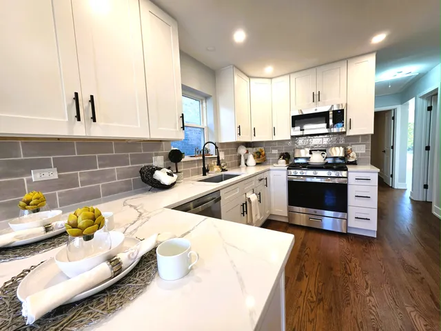 a bathroom with a sink toilet and mirror