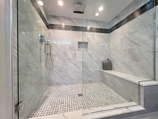 a bathroom with a toilet sink and shower