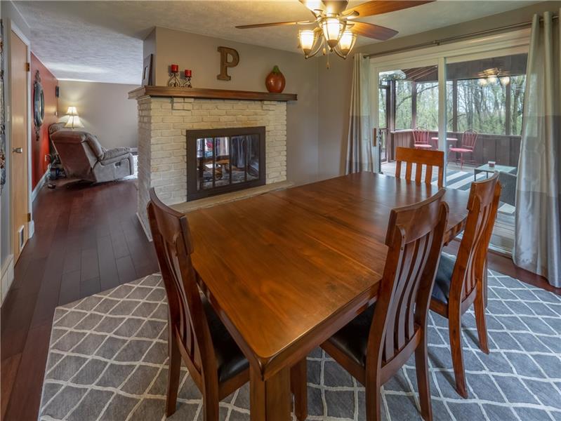 4137 Ewalt Road Gibsonia, PA 15044 - Photo 11 of 25 Dining area open to the family room with a double sided fireplace and accessible to the covered deck.
