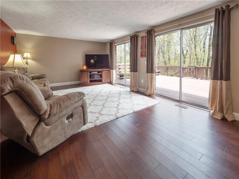 4137 Ewalt Road Gibsonia, PA 15044 - Photo 12 of 25 Wow, look at the space and elegance of this family room with direct access to the deck overlooking the woods! Those floors though...