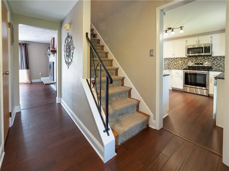 4137 Ewalt Road Gibsonia, PA 15044 - Photo 3 of 25 Spacious entry with bamboo flooring, modern paint and access to Den, Kitchen, Family Room and second level. New front door greets you with style.
