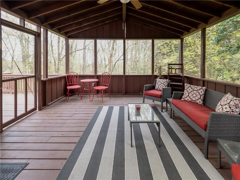 4137 Ewalt Road Gibsonia, PA 15044 - Photo 21 of 25 HUGE covered deck accessible from the dining room. This adds space for entertaining, relaxing and more. Tucked away in the woods this is a DREAM.