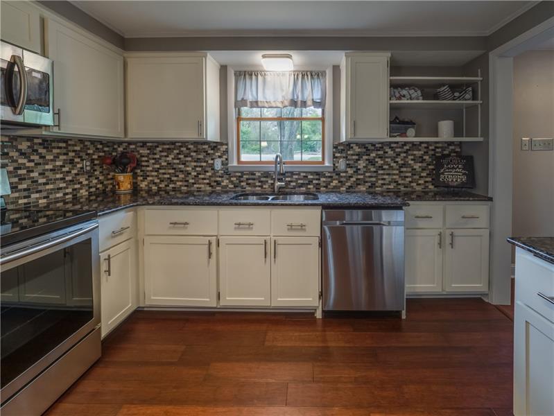 4137 Ewalt Road Gibsonia, PA 15044 - Photo 6 of 25 Another view of the amazing kitchen from the eating bar. All countertops are gleaming granite.