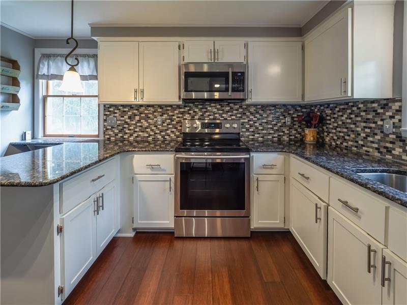 4137 Ewalt Road Gibsonia, PA 15044 - Photo 7 of 25 Eating area to the left, spacious enough for quick casual meals but open to large dining area with bay window.