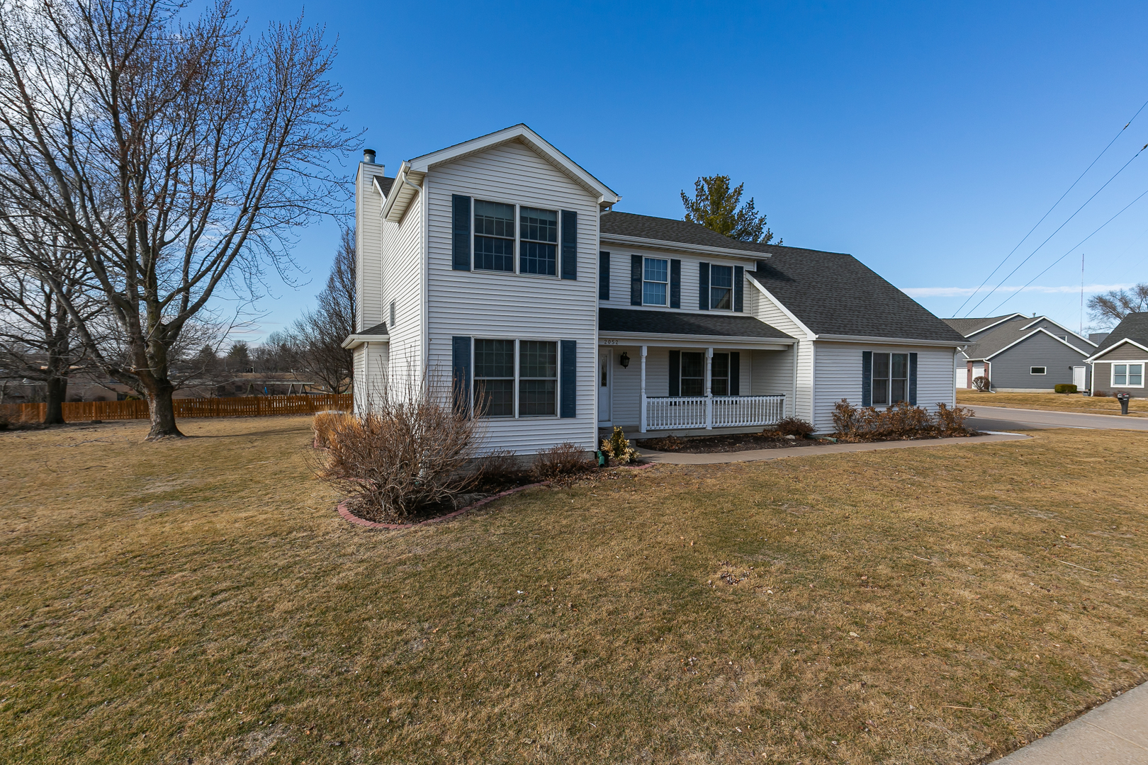 2052 Ashford Road Bettendorf, IA 52722 - Photo 1 of 40 a front view of a house with a garden