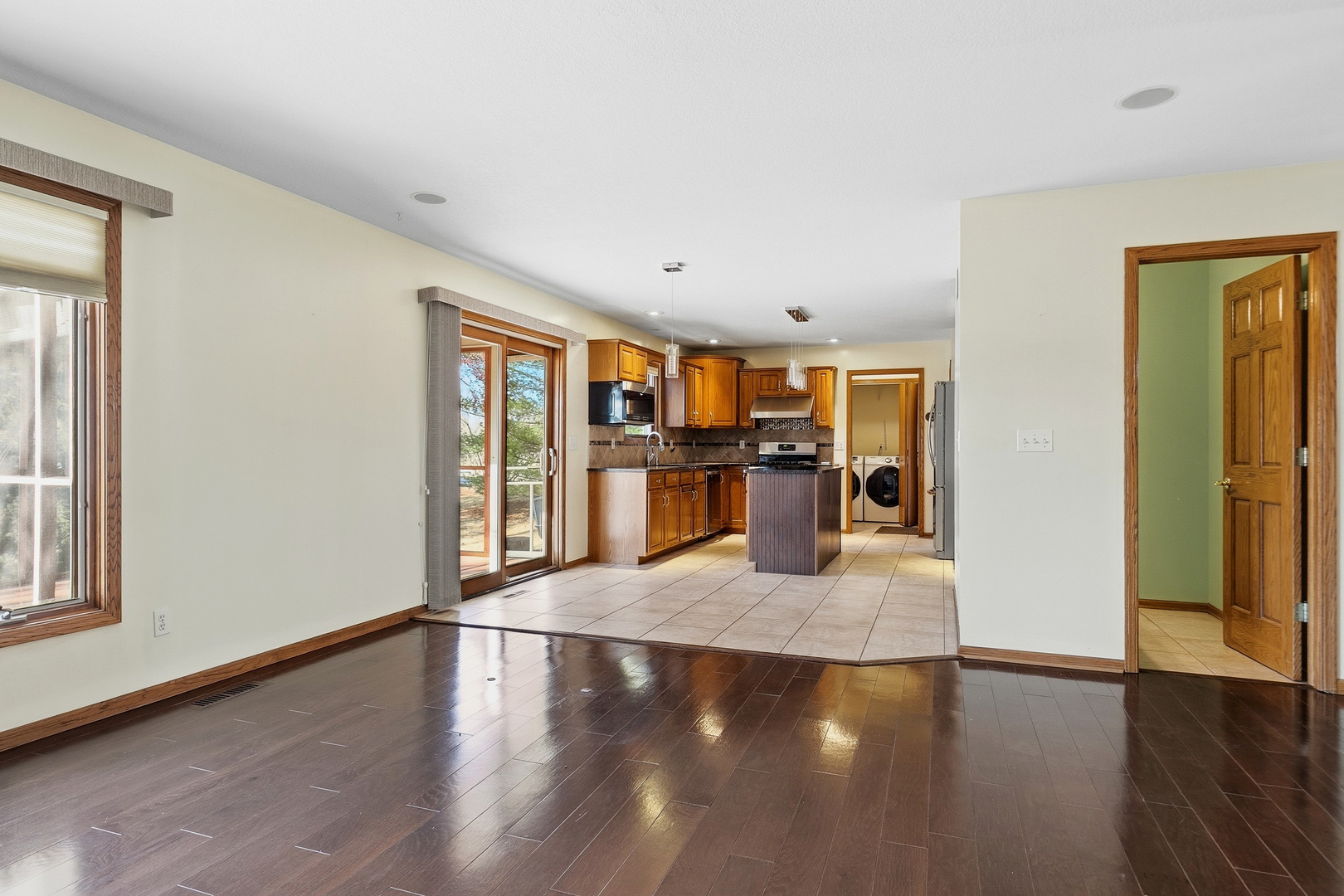 2052 Ashford Road Bettendorf, IA 52722 - Photo 17 of 40 an empty room with wooden floor and windows
