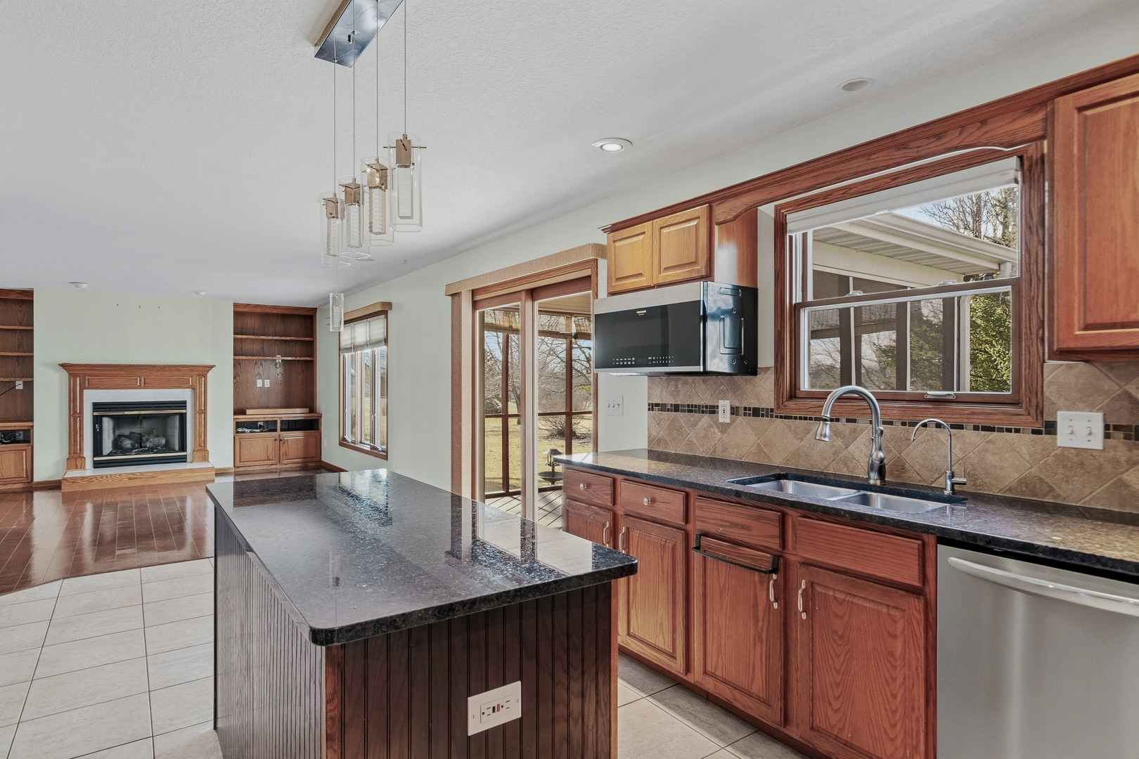 2052 Ashford Road Bettendorf, IA 52722 - Photo 21 of 40 a bathroom with a granite countertop sink and a large mirror