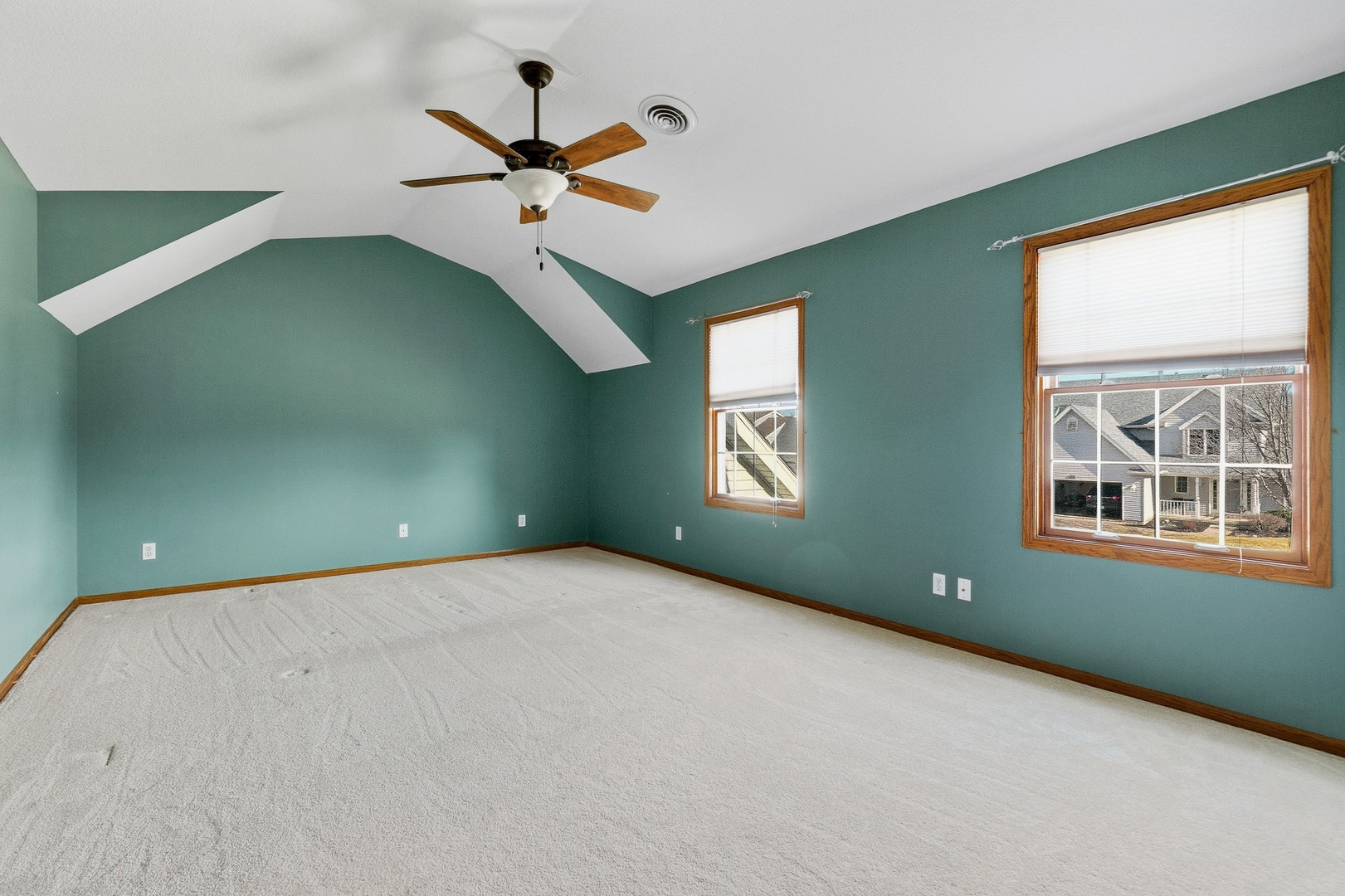 2052 Ashford Road Bettendorf, IA 52722 - Photo 25 of 40 an empty room with windows and fan