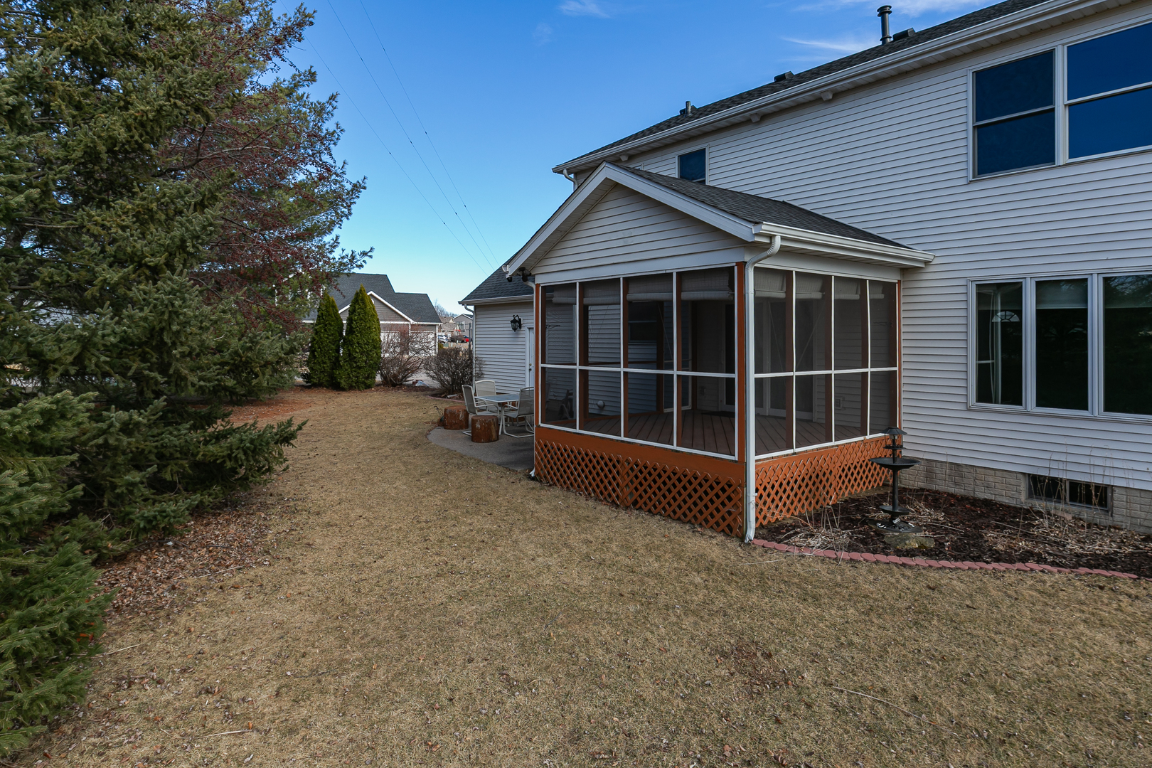 2052 Ashford Road Bettendorf, IA 52722 - Photo 5 of 40 a view of a house with a large window and wooden fence