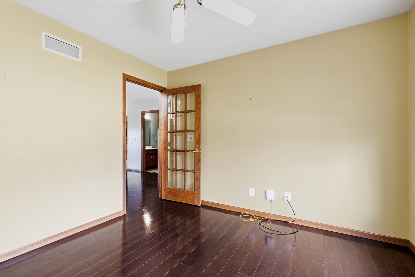 2052 Ashford Road Bettendorf, IA 52722 - Photo 10 of 40 an empty room with wooden floor and windows