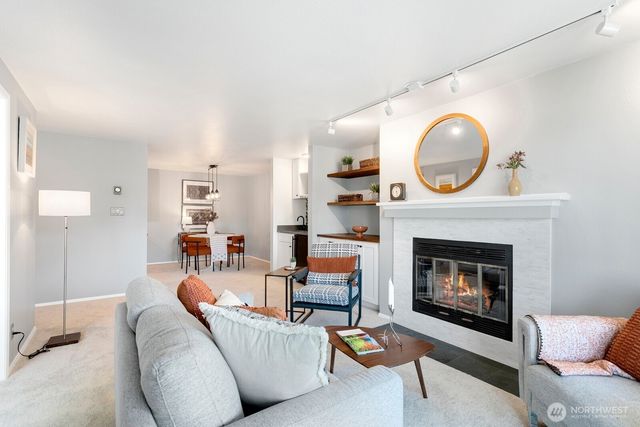 a living room with furniture a fireplace and a fireplace