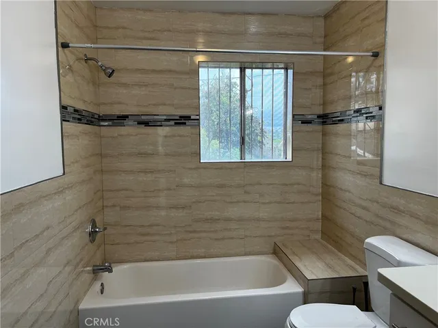 a bathroom with a shower and bathtub