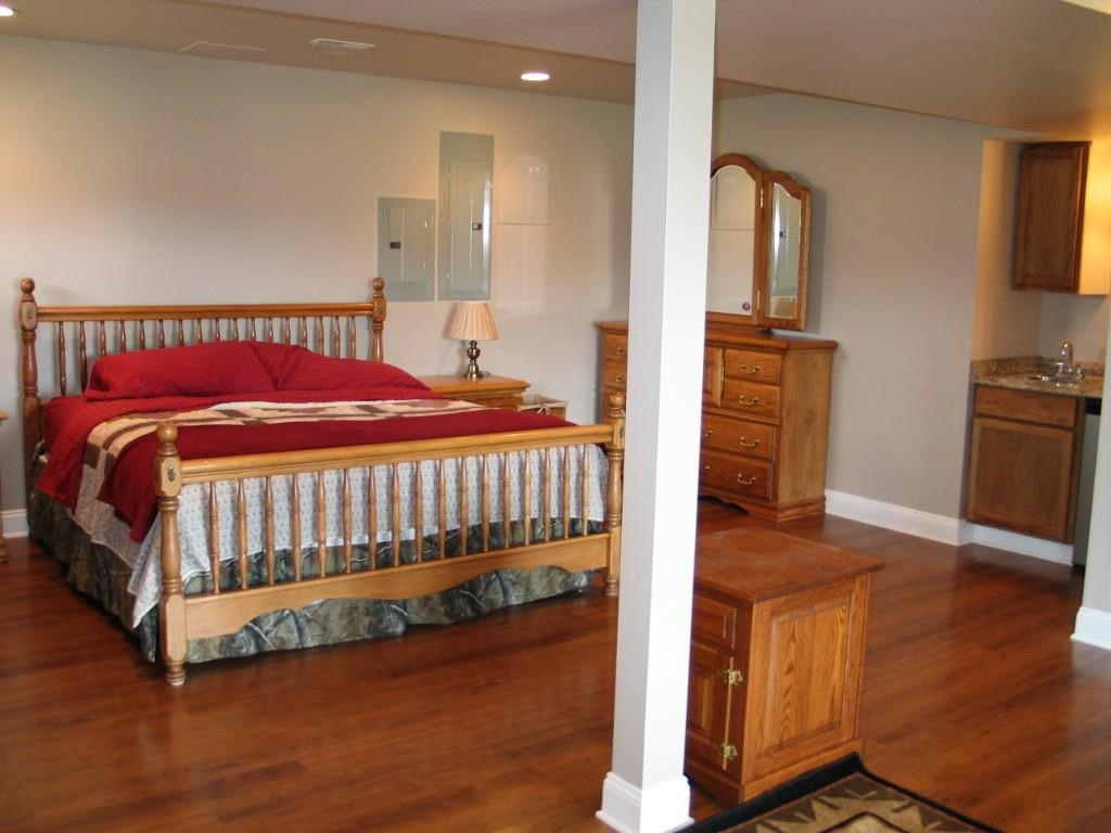 2864 Duet Road, Unit 2 Etlan, VA 22719 - Photo 18 of 25 a bedroom with a bed and wooden floor