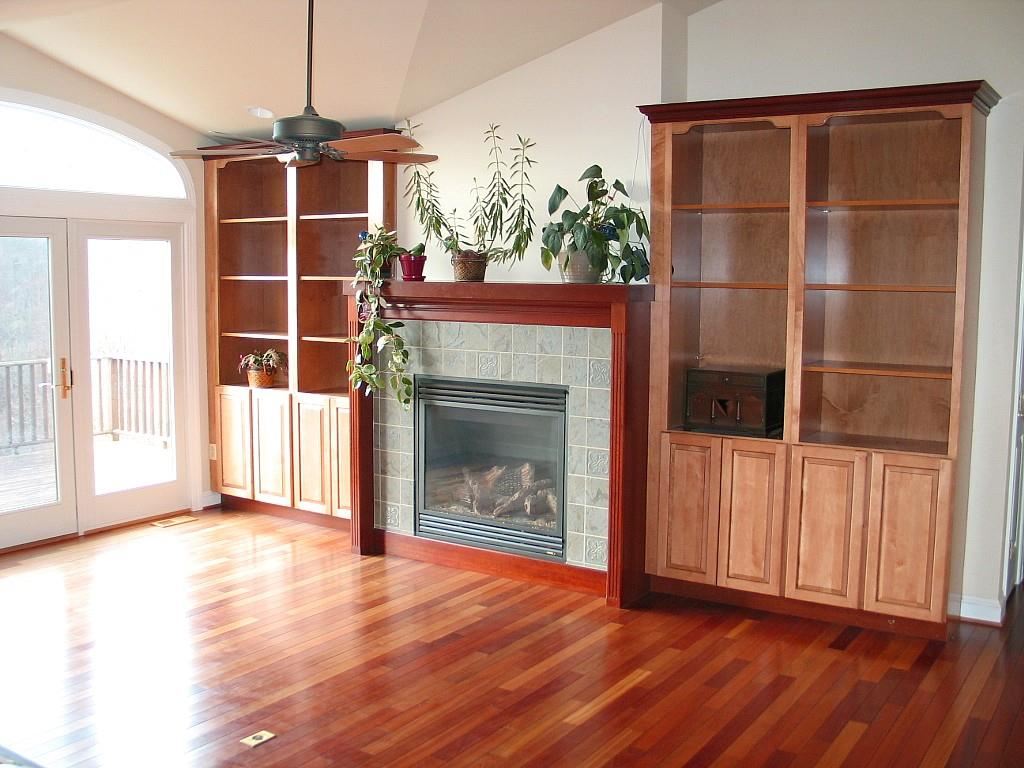 2864 Duet Road, Unit 2 Etlan, VA 22719 - Photo 3 of 25 an empty room with wooden floor a fireplace and windows