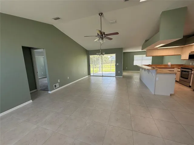 a view of a kitchen with a sink and a window