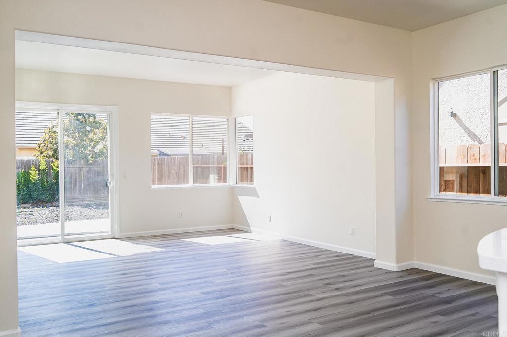 3005 Litt Road Modesto, CA 95355 - Photo 16 of 53 a view of an empty room with wooden floor and a window