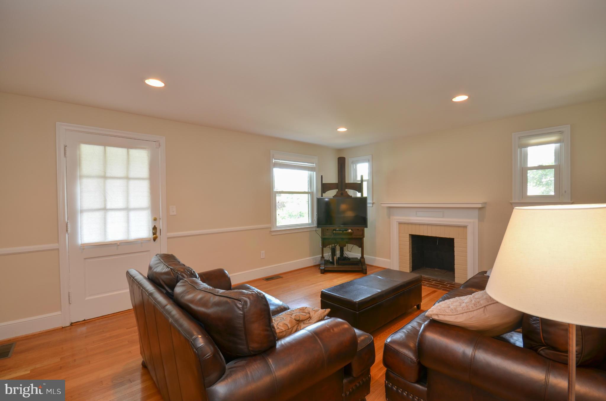 903 Forest Glen Road Silver Spring, MD 20901 - Photo 6 of 30 a living room with furniture fireplace and window