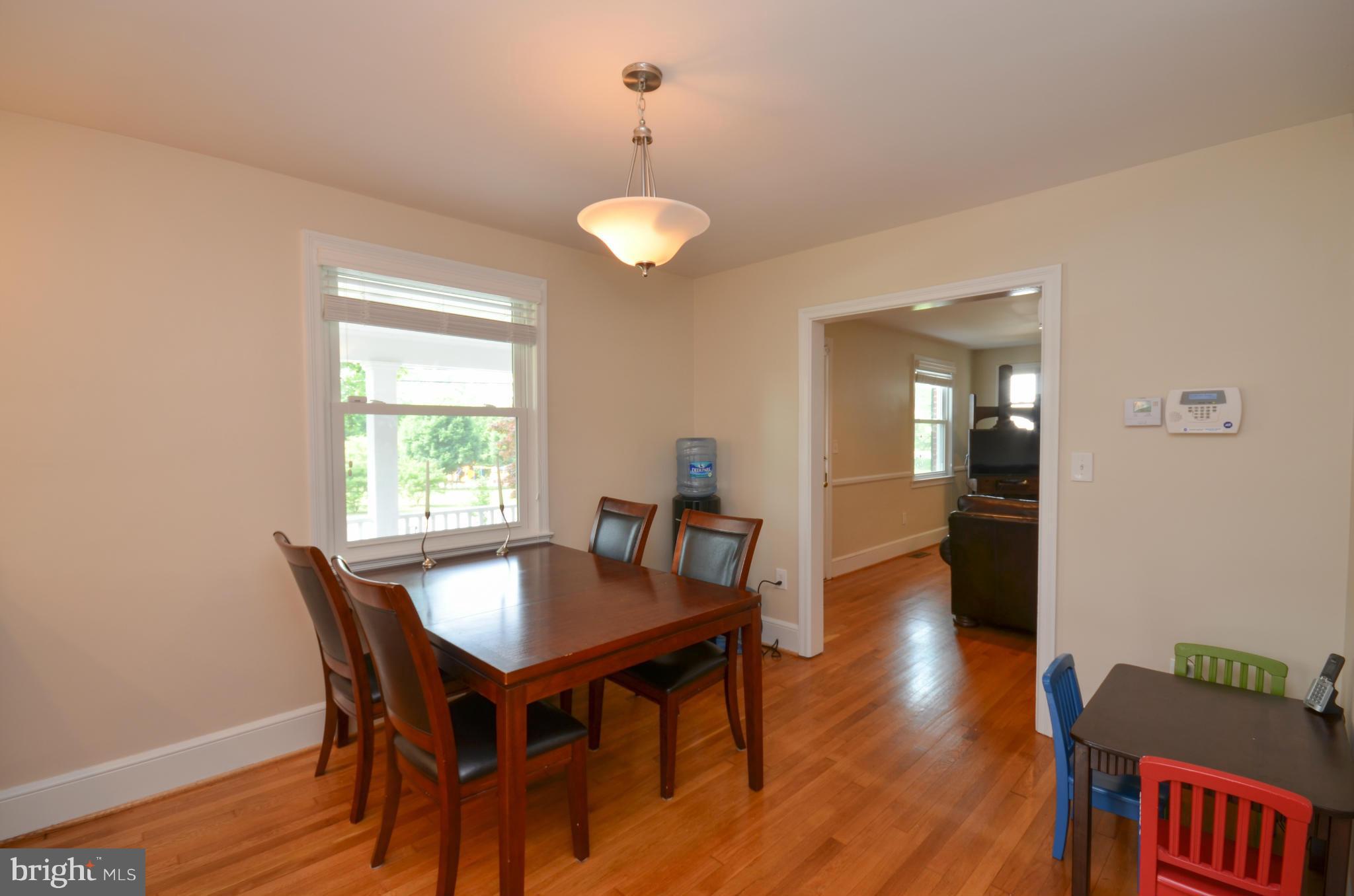 903 Forest Glen Road Silver Spring, MD 20901 - Photo 8 of 30 a view of a dining room with furniture and wooden floor