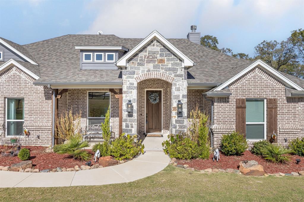 408 Herb Stephens Avenue Springtown, TX 76082 - Photo 1 of 1 front view of a house with a yard
