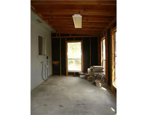 a view of a room with a large window