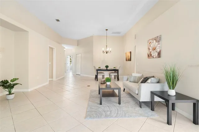 a patio with yard glass top table and chairs