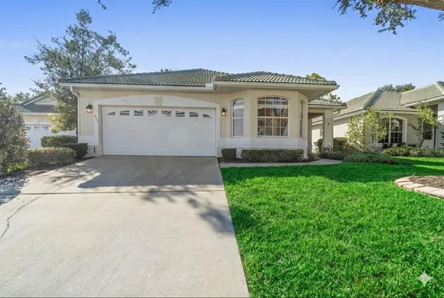 a view of house with backyard