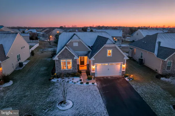 a view of a big house with a big yard