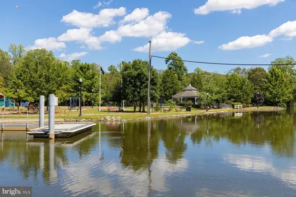 a view of residential house with outdoor space and lake view