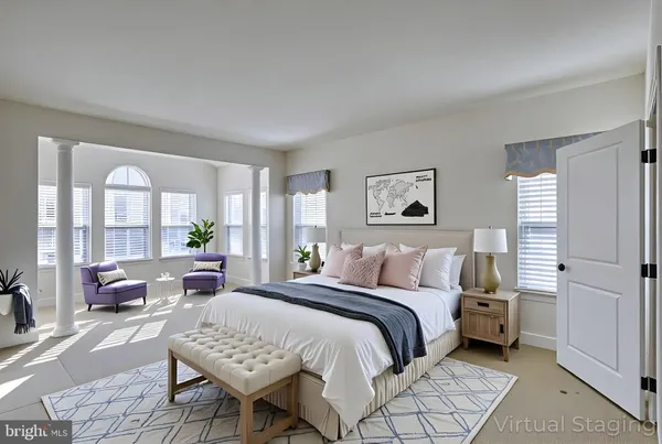 a bedroom with a bed and a couch